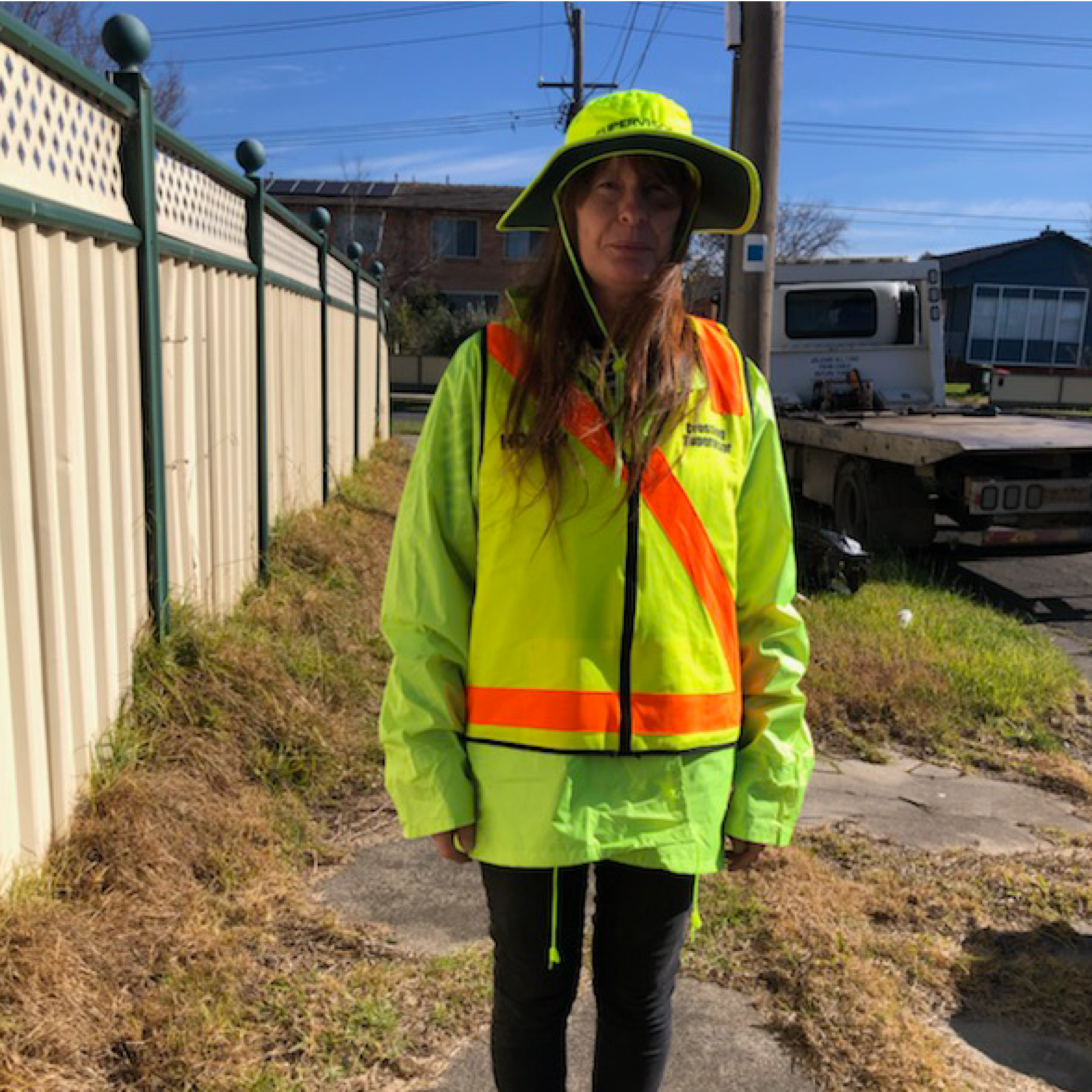 Jennifer brightens the day with her uniform and her smile as she helps kids cross the road safely