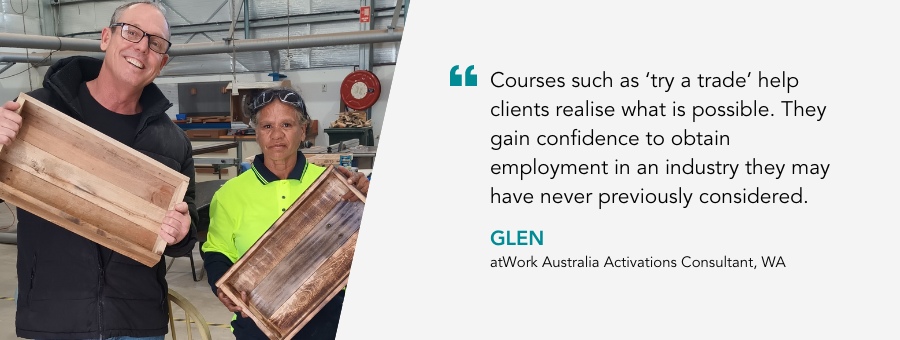 Tracey and Glen hold up a wooden crate they made. Quote reads "“Courses such as ‘try a trade’ help clients realise what is possible. They gain confidence to obtain employment in an industry they may have never previously considered.” said Glen