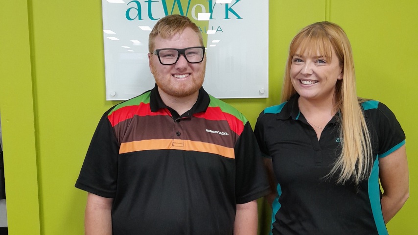 Corey smiles in his Hungry Jacks uniform